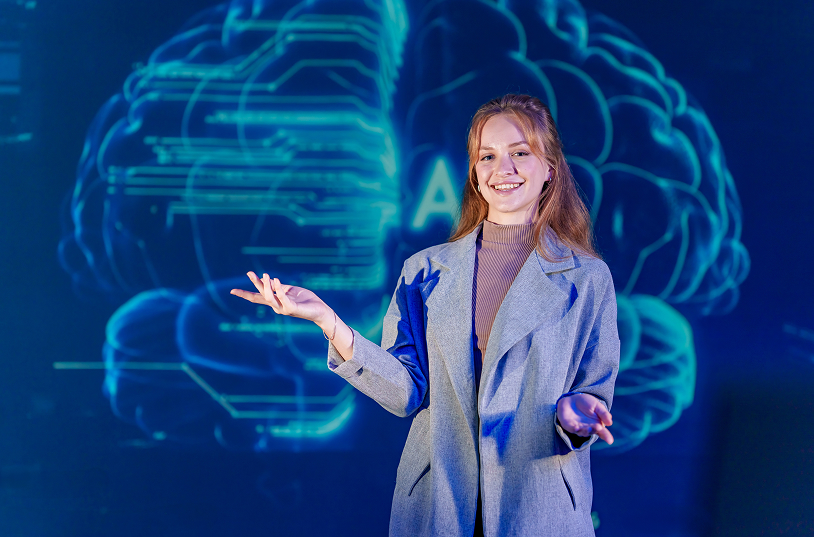 woman-presenting-artificial-intelligence-technolog-2026-01-09-13-01-03-utc 1